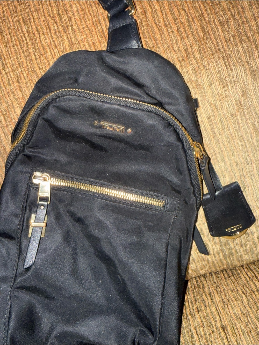 Tumi Black Sling Belt Bag with Gold Hardware